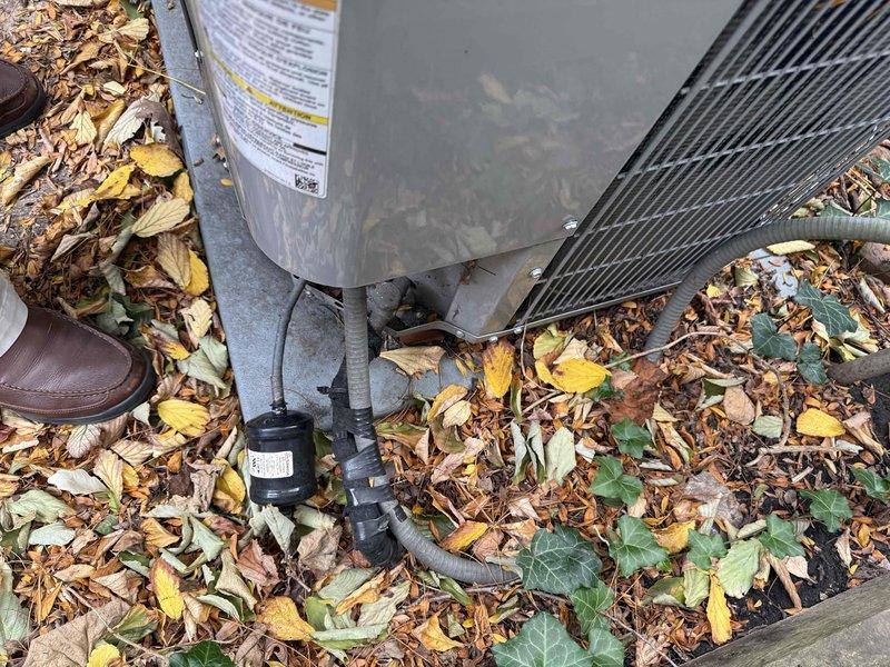 Performed an on-site evaluation and prepared a quote for full system replacement of an approximately 13-year-old HVAC system. The outdoor condenser unit, set on a concrete pad, was inspected and found to have heavy leaf and debris accumulation around its base and conduits. The attic-mounted Carrier whole-house humidifier, with its duct connection and drain line, was inspected and found clean and intact. Documented the equipment with photos to support the replacement proposal.