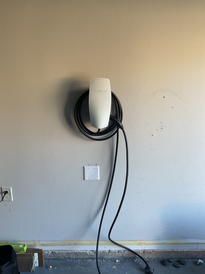 Install Tesla charger. Replaced GFCI receptacle. Replace breakers.