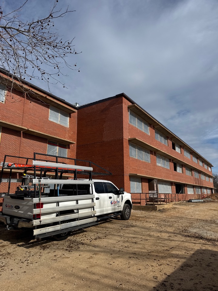 Measuring for storefront at Ft. Leonard Wood