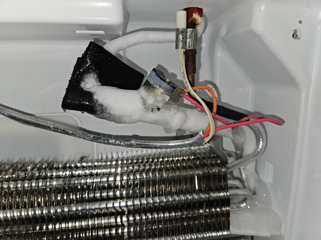 Got called out to this LG bottom freezer in Palatine IL that was not cooling nor freezing, and this is why: this little bit of frost on the evaporator should be filling this entire evaporator coil. 