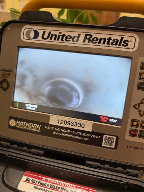I arrived at the daycare facility and met with the staff, who explained that they had been experiencing a recurring clog. I used the two existing cleanouts to access the main sewer line and advanced the inspection camera through it. I encountered a double-Y fitting that appeared to have been installed backwards, which is not permitted for underground use. The remainder of the sewer system appeared to be in good condition with no other issues detected.