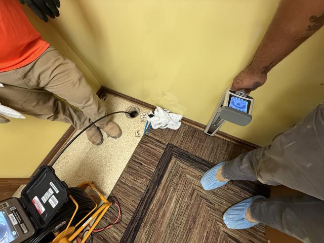 I arrived at the daycare facility and met with the staff, who explained that they had been experiencing a recurring clog. I used the two existing cleanouts to access the main sewer line and advanced the inspection camera through it. I encountered a double-Y fitting that appeared to have been installed backwards, which is not permitted for underground use. The remainder of the sewer system appeared to be in good condition with no other issues detected.