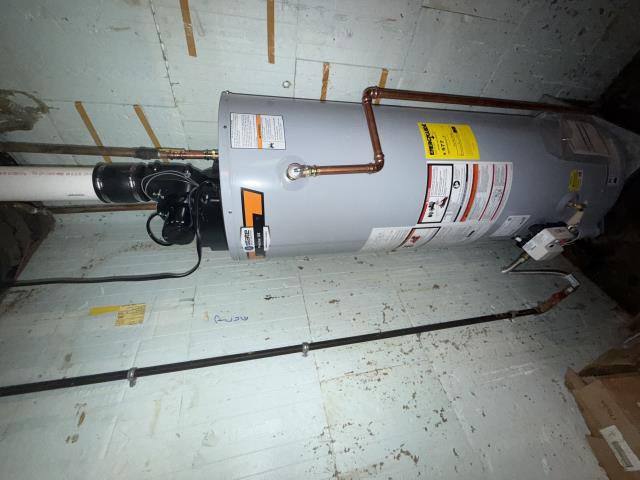 Upon arrival at the property, our technician met with the customer, who directed us to the failing water heater. A thorough inspection revealed significant leakage through the gas igniter and down to the base of the unit, confirming that the water heater had failed completely and required replacement. After discussing options with the homeowner, it was agreed to proceed with a direct swap installation.

The appropriate replacement water heater and necessary materials were retrieved, and the removal process began. The existing water heater was safely disconnected and removed. The new water heater was then set in place and installed, with the water lines reconnected using ProPress couplings to ensure a secure and reliable seal. The gas supply line was properly reconnected, and the venting system was rerouted to accommodate the new unit’s slightly different vent discharge location.

Once all connections were made, the water supply was restored, and the system was tested thoroughly. Al