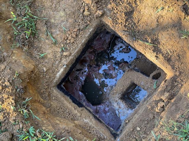 I was called to inspect a septic tank that had not been pumped in over 15 years. Upon inspection, I observed significant grease buildup on both sides of the tank. The tank had only been pumped twice, once approximately 15 years ago and again about 3 years ago. At the homeowner's request, I left the tank exposed but put the septic lids back on.