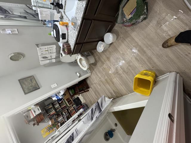 When we arrived on site, we noticed water and solids were overflowing from the toilet and the shower. We carefully tried to clean water up with Crawltec as we removed the toilet. They continuously vacuumed water all over the floor and from toilet flange. We ran a snake and were finally able to clear the clog. Washed out shower and got rid of solids and water. Ran a snake and removed toilet.