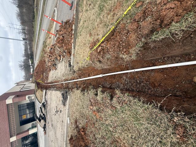 Installed new underground PVC water service line from meter to building, including trenching, bedding, and preparation for backfill.