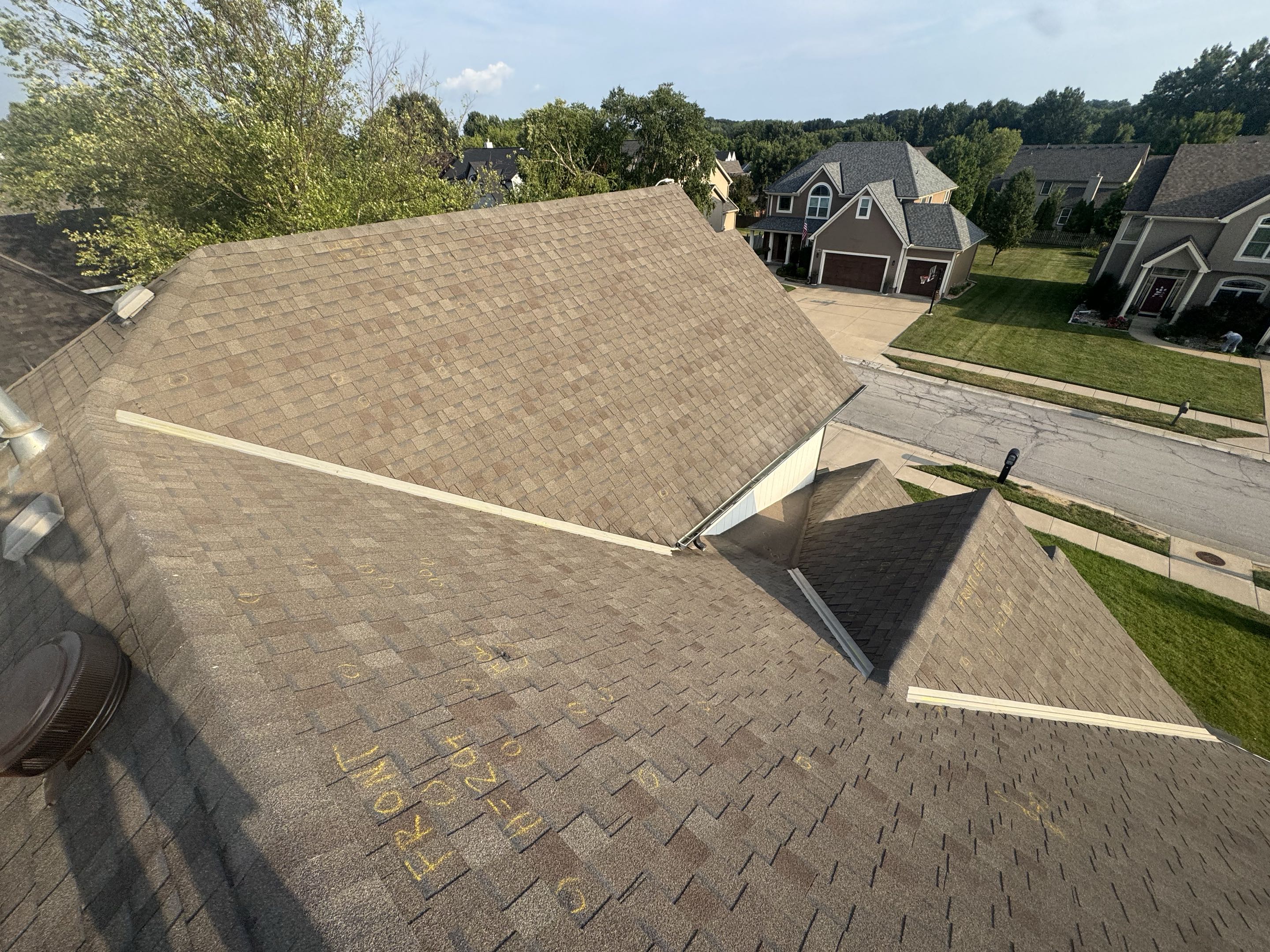 A thorough inspection was conducted to assess the need for roof replacement. Significant hail damage was identified, compromising the integrity of the existing roofing system. Detailed documentation of the damage was prepared, including photographs and a comprehensive report. This evidence will be presented during a meeting with the insurance adjuster to facilitate the claims process for the replacement of four roofs. The inspection process involved a meticulous examination of the roof's condition, identifying specific areas affected by hail, and evaluating the extent of the damage. This detailed assessment ensures that all necessary information is provided to support the insurance claim and expedite the replacement process.
