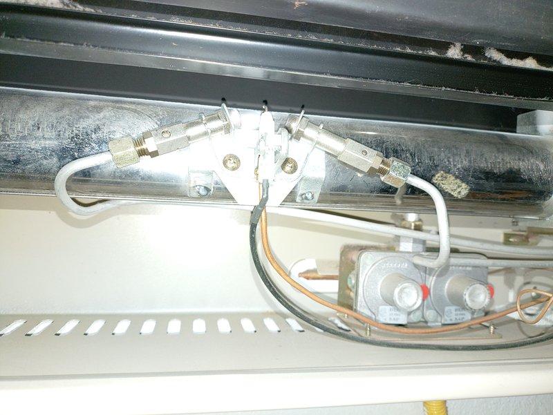 Performed routine maintenance service on two wall-mounted gas heating units. Inspected refrigerant lines, valving components, and internal control systems on both units. Identified missing temperature control knob on the smaller rear unit and documented for replacement. Both units are now properly serviced and operational with the exception of the control knob which will require replacement parts.