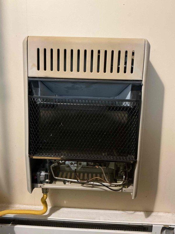 Performed routine maintenance service on two wall-mounted gas heating units. Inspected refrigerant lines, valving components, and internal control systems on both units. Identified missing temperature control knob on the smaller rear unit and documented for replacement. Both units are now properly serviced and operational with the exception of the control knob which will require replacement parts.