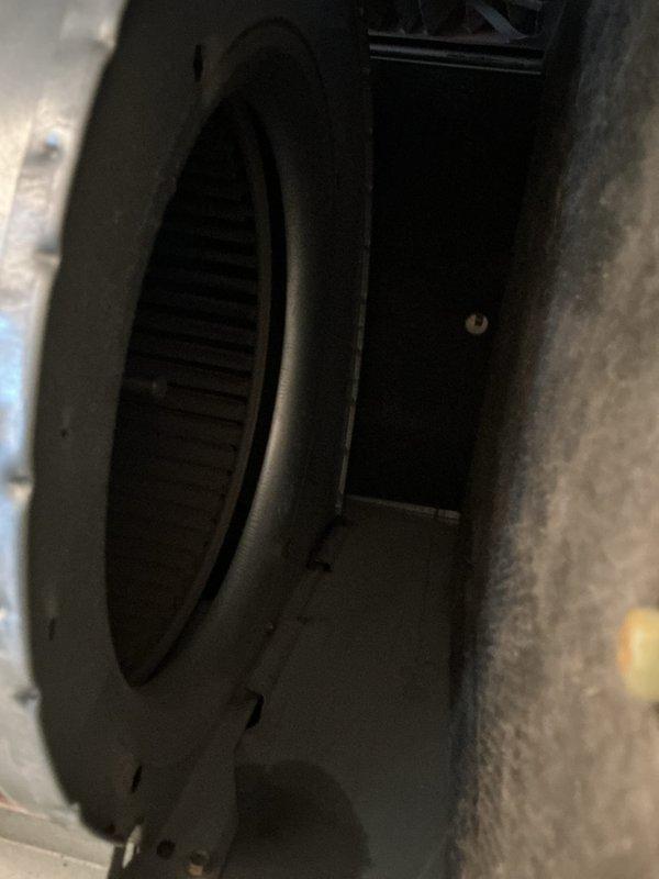 Performed complete furnace maintenance inspection as requested. Inspected blower assembly and fan housing for proper operation. Examined capacitor (marked "MFD 5%") and related electrical components to verify system functionality. All components operating within normal parameters.
