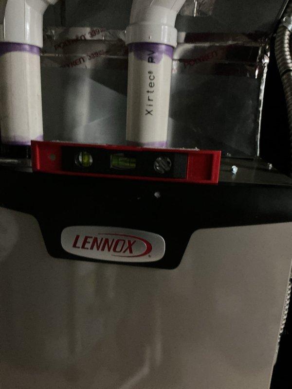 Responded to service call for Lennox furnace with panel security issue. Inspected unit and found top panel grippers worn and unable to hold panel closed. Installed new panel fasteners and verified secure closure to prevent air leakage and ensure proper operation.