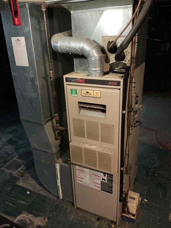 Responded to tenant's no heat complaint at rental property. Performed diagnostic inspection on Lennox WatchGuard furnace system. Found deterioration at base of white brick exhaust column affecting proper venting. Cleaned connections and restored proper heat function. System now operating normally.