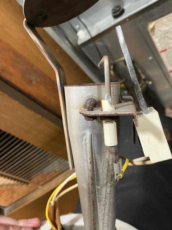 Performed scheduled maintenance on a 5-year-old furnace. Inspected burner assembly and heat exchanger, noting minor corrosion beginning to form. Checked ignitor functionality and electrical connections, particularly focusing on the yellow wiring. System is operational but recommended continued annual maintenance to monitor developing rust on metal components.