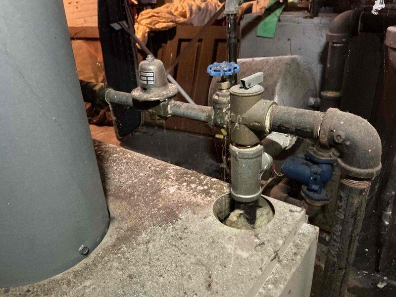 Responded to service call for inoperative PCB boiler previously serviced by technician Darrell. Confirmed gas service has been restored to the property. Inspected aged plumbing infrastructure including pipe assembly, valve connections, and pressure regulator. System now operational after proper commissioning sequence performed.