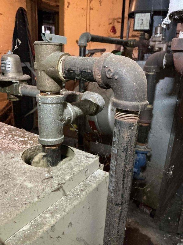Responded to service call for inoperative PCB boiler previously serviced by technician Darrell. Confirmed gas service has been restored to the property. Inspected aged plumbing infrastructure including pipe assembly, valve connections, and pressure regulator. System now operational after proper commissioning sequence performed.