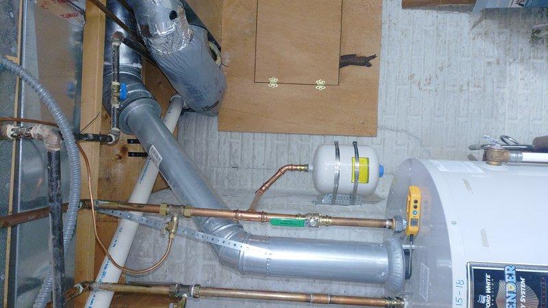 Responded to urgent call regarding non-operational hot water tank in 88-year-old home. Upon inspection, discovered faulty pressure relief valve and compromised expansion tank. Replaced valve, installed new expansion tank, and verified proper connections to copper supply lines. System now operating within normal parameters with no leaks detected.