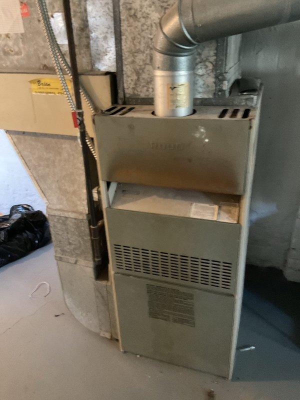 Conducted AC replacement estimate at customer's residence. Inspected existing electrical panel to verify appropriate capacity for potential new system. Evaluated aging furnace unit with visible wear and connected ductwork to determine compatibility with proposed AC installation. Documented current setup with photos for accurate system sizing and installation planning.