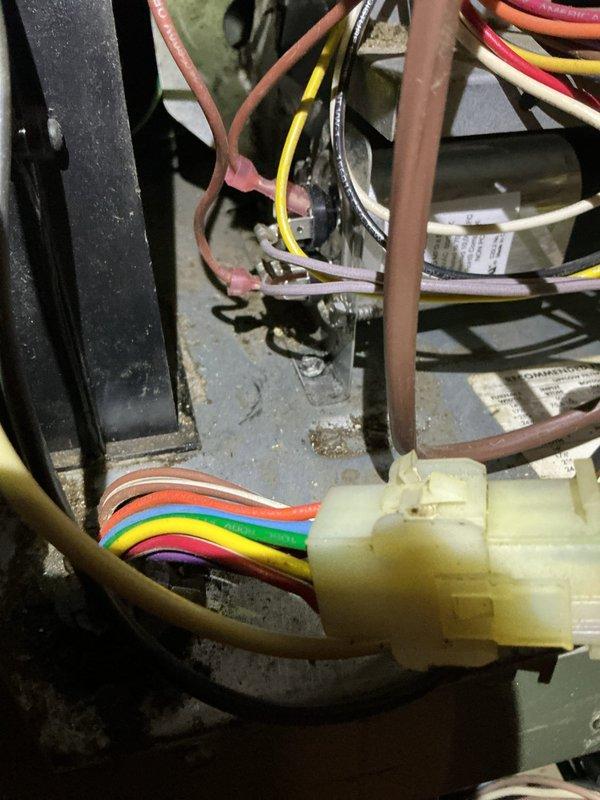 Responded to customer complaint of heating system intermittently shutting down. Diagnosed faulty wiring connection at the control board where the rainbow wire harness exhibited poor contact. Repaired loose connections, cleaned dust accumulation from control assembly, and verified proper operation through multiple test cycles. System now functioning correctly with stable operation.
