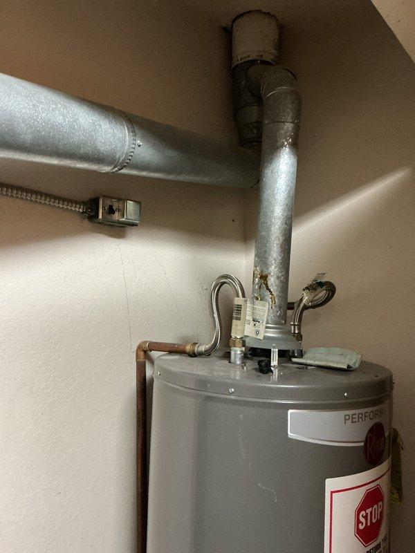 Performed routine furnace tune-up service per customer arrangement (key access provided with landlord approval). Upon inspection, noted water heater installation with signs of corrosion on exhaust vent pipe connections. Heating system was tested, cleaned, and verified for proper operation. No major issues requiring immediate attention were identified.