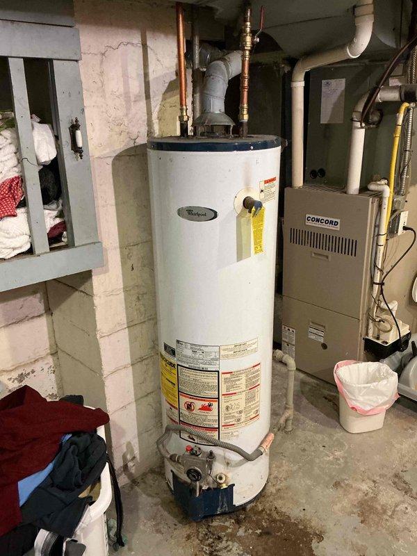 Responded to service call for water heater repair in 3-year-old home. Inspected tanked water heater system in basement utility room which showed signs of minor leakage at base. Performed necessary repairs to address water leakage issue and verified proper operation of the heating system before completing service.