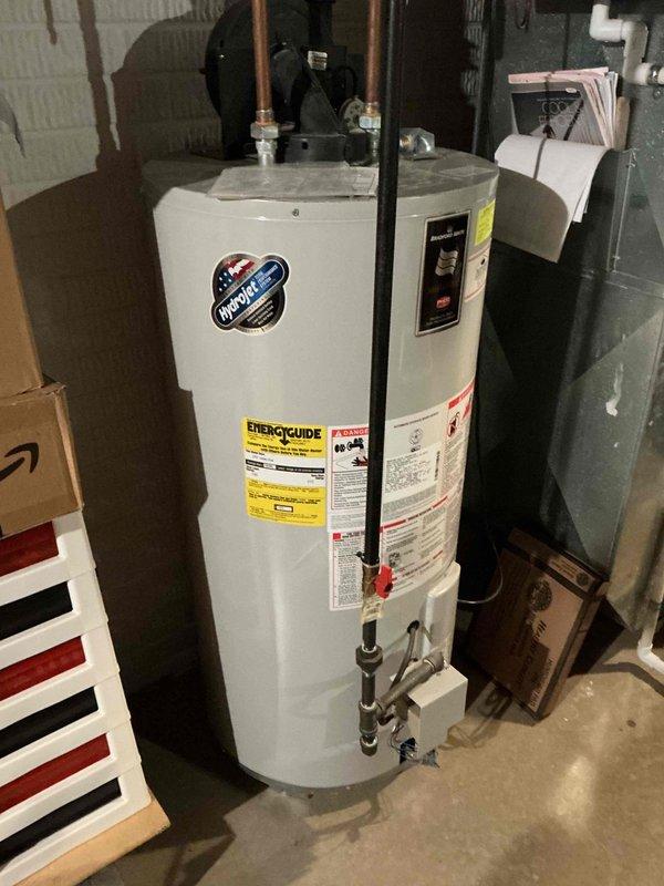 Performed standard furnace tune-up maintenance service on residential HVAC system. Inspected furnace unit, connections, and ductwork; all components found in normal operating condition with no visible issues. System is properly installed with appropriate connections to water heater and ventilation.