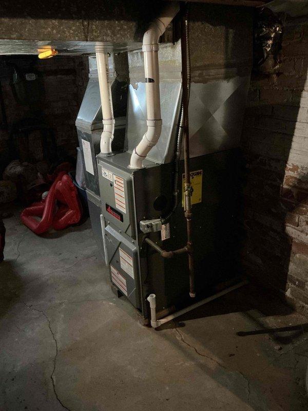 Performed scheduled furnace tune-up in basement utility room. Conducted comprehensive inspection of the heating system including blower motor assembly, electrical connections, and gas line. Cleaned internal components and verified proper ventilation through PVC exhaust pipes. System is now operating at optimal efficiency.