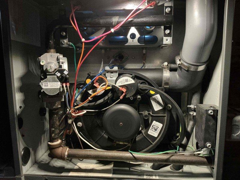 Performed scheduled furnace tune-up in basement utility room. Conducted comprehensive inspection of the heating system including blower motor assembly, electrical connections, and gas line. Cleaned internal components and verified proper ventilation through PVC exhaust pipes. System is now operating at optimal efficiency.