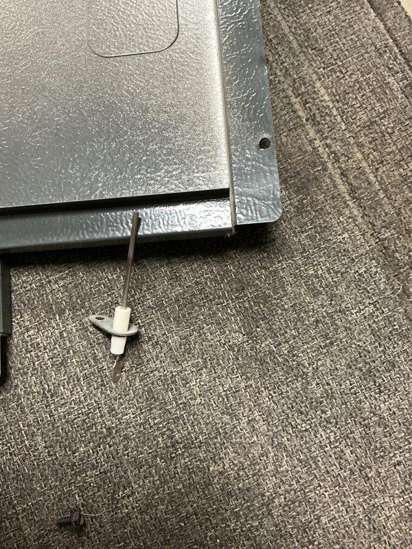 Performed routine furnace maintenance service. Inspected gas line connections and verified proper installation of yellow flexible gas connector. Examined furnace panel fasteners and replaced worn clip to ensure secure panel attachment.