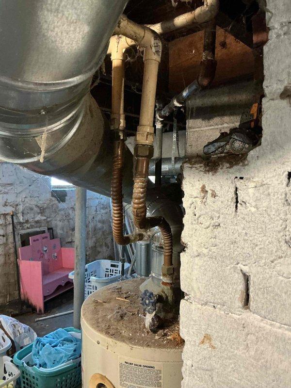 Completed tune-up service on 5-year-old furnace. Inspected system components including heat exchanger, burners, and flue pipes. Cleaned and checked adjacent water heater connections for proper operation. All systems functioning normally with no issues detected.