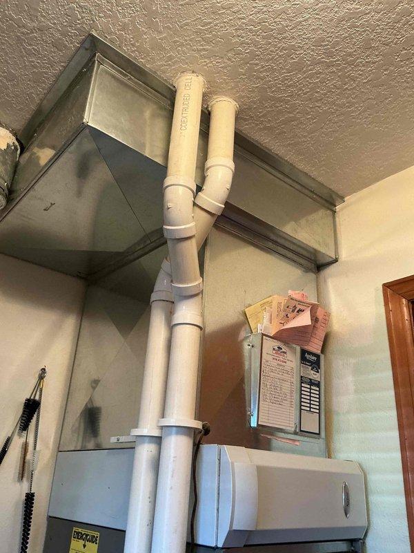 Performed annual maintenance on 13-year-old gas furnace system. Inspected Lennox equipment, checked all connections and components. Opened front panel to examine blower motor, control board, and internal wiring - all functioning properly. Verified proper venting through PVC pipes, noted appropriate labeling and warning stickers intact. System operating within normal parameters after service.
