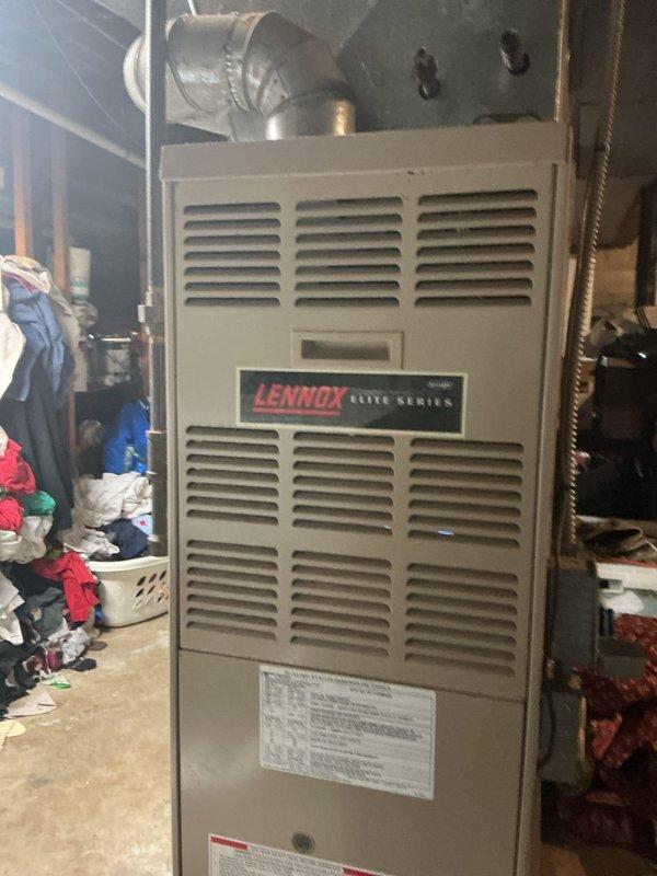 Responded to no-heat call for Lennox Elite Series furnace. Diagnosed issue with flame sensor, which was removed, cleaned using abrasive tool to remove carbon buildup, and reinstalled. System now operating properly with consistent flame detection and normal heating cycle.