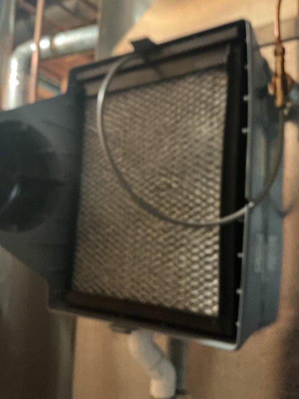 Performed scheduled maintenance on 5-6 year old gas furnace. Inspected and cleaned air filter with metallic mesh screen. Temperature readings were taken with digital meter showing 112° on ductwork, confirming proper system operation. All components functioning within normal parameters.