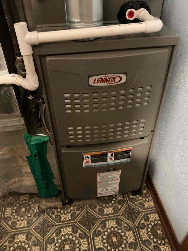 Completed scheduled heating maintenance service on Lennox furnace system. Inspected furnace, associated ductwork, Aprilaire air treatment unit, and PVC exhaust components. System appears properly installed in utility room with no visible issues noted.