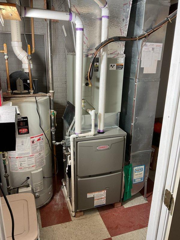 Successfully installed a Lennox 96% efficient, 90kBtu up-flow furnace with required metal spacer for C-B cabinet compatibility. System was properly leveled during installation and includes a Honeywell WiFi thermostat for enhanced temperature control. PVC venting was completed with appropriate primer at all joints, and the unit was installed in the utility room adjacent to the existing water heater.