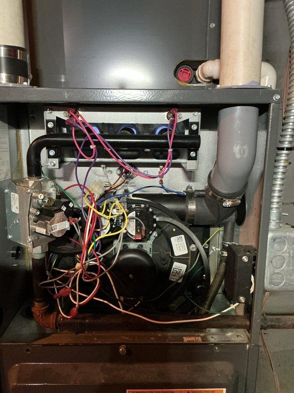 Diagnosed Goodman furnace with no heat complaint. Inspection revealed system was only blowing cold air. Accessed interior components and identified faulty ignition sequence. Repaired connection issue in control board wiring, restored proper heating function, and verified normal operation before completing service.