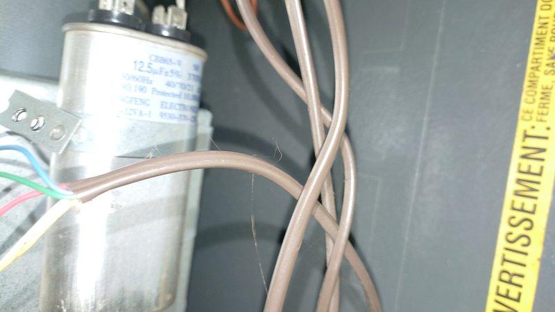 Diagnosed short cycling furnace issue caused by dirty air filter restricting proper airflow. Replaced severely clogged filter and inspected capacitor and electrical connections, finding them in good working condition. System now operating with normal cycle times and proper temperature regulation.