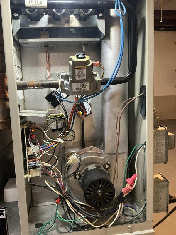 Responded to no-heat call at customer's approximately 10-year-old residence. Inspected furnace and water heater systems. Diagnosed issues with both appliances, performed necessary repairs including checking gas valve assembly, blower motor functionality, and electrical connections in the furnace. Reset and tested water heater control unit (Resideo brand), confirming proper pilot light operation and status indicator functioning. Both heating systems restored to normal operation.
