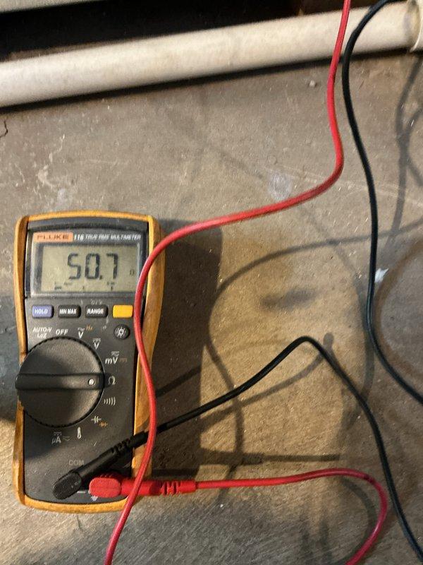 Performed routine maintenance on a 4-year-old furnace. Conducted electrical testing with Fluke 116 multimeter, measuring resistance at 50.7 ohms. Inspected control box wiring connections and verified proper terminal connections for white, blue, yellow, and orange wires.