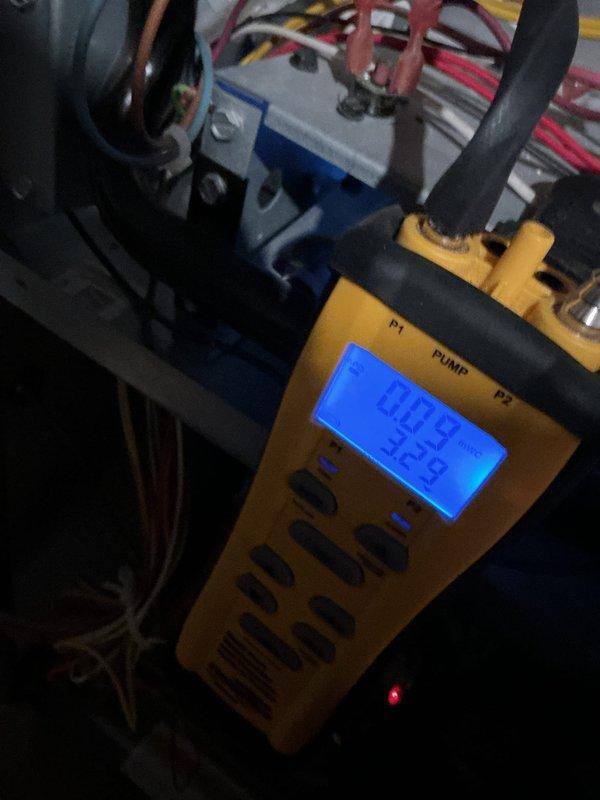Performed routine maintenance on 5-year-old furnace. Conducted comprehensive system inspection with visual examination of interior components and connections. Utilized digital pressure gauge to verify proper system operation at 20.9 reading, confirming all electrical connections and gas valve functionality within manufacturer specifications.