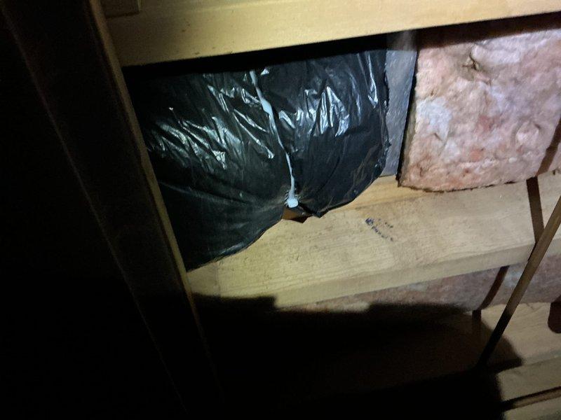Replaced damaged flexible ductwork in crawl space, securing new insulated black flex ducts with appropriate fasteners and sealing with metal tape. Installed vapor barrier and added pink fiberglass insulation between joists to improve system efficiency and prevent heat loss.