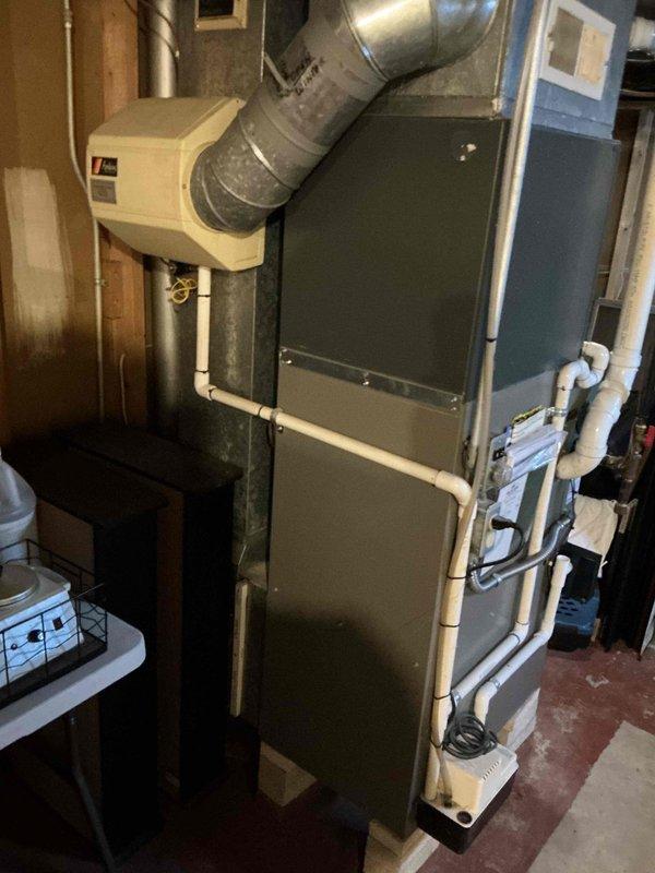 Responded to no-heat call for 15-year-old natural gas furnace. Conducted full diagnostic inspection of internal components including blower motor assembly, electrical connections, and Honeywell control system. Restored heating function by cleaning connections and performing necessary adjustments to ensure proper operation.