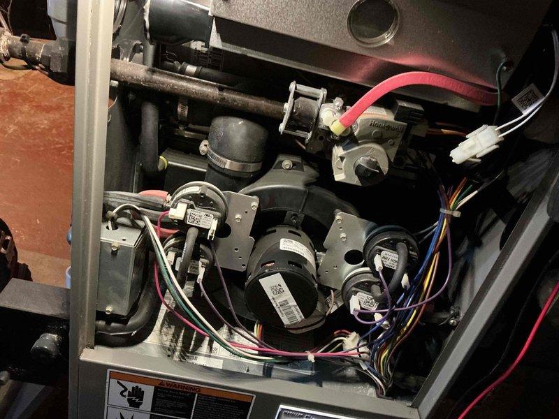 Responded to no-heat call for 15-year-old natural gas furnace. Conducted full diagnostic inspection of internal components including blower motor assembly, electrical connections, and Honeywell control system. Restored heating function by cleaning connections and performing necessary adjustments to ensure proper operation.