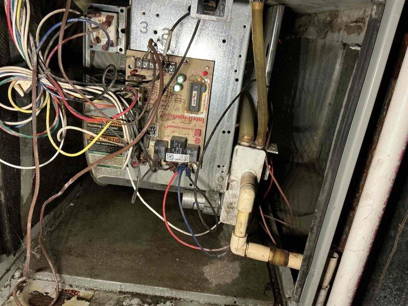 Responded to no-heat call for aging 15+ year old furnace. Performed diagnostic inspection of circuit board and electrical components, noting visible wear on wiring connections. Examined gas valve, motor assembly and drainage system which showed signs of normal operational wear and minor corrosion consistent with the unit's age.