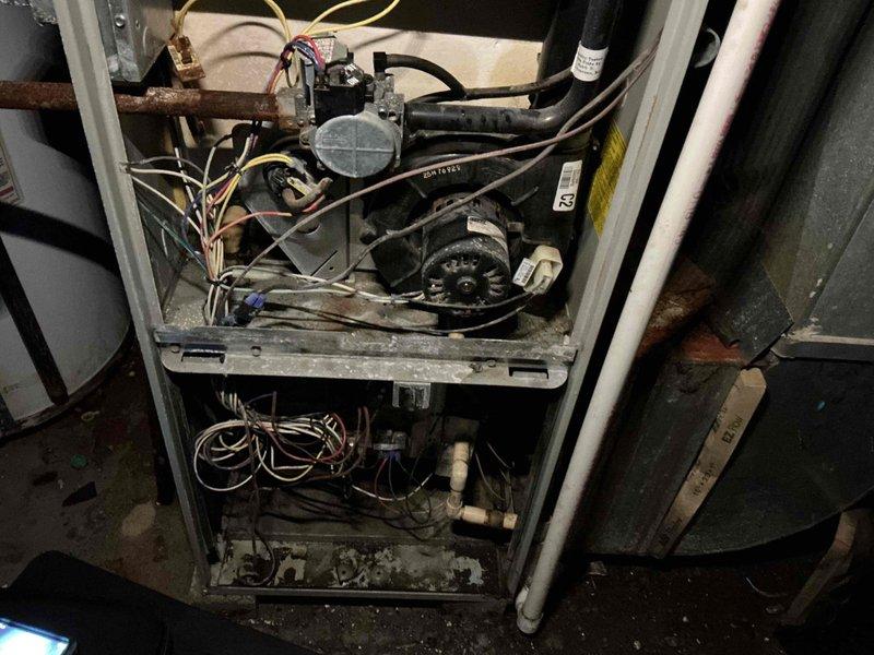 Responded to no-heat call for aging 15+ year old furnace. Performed diagnostic inspection of circuit board and electrical components, noting visible wear on wiring connections. Examined gas valve, motor assembly and drainage system which showed signs of normal operational wear and minor corrosion consistent with the unit's age.