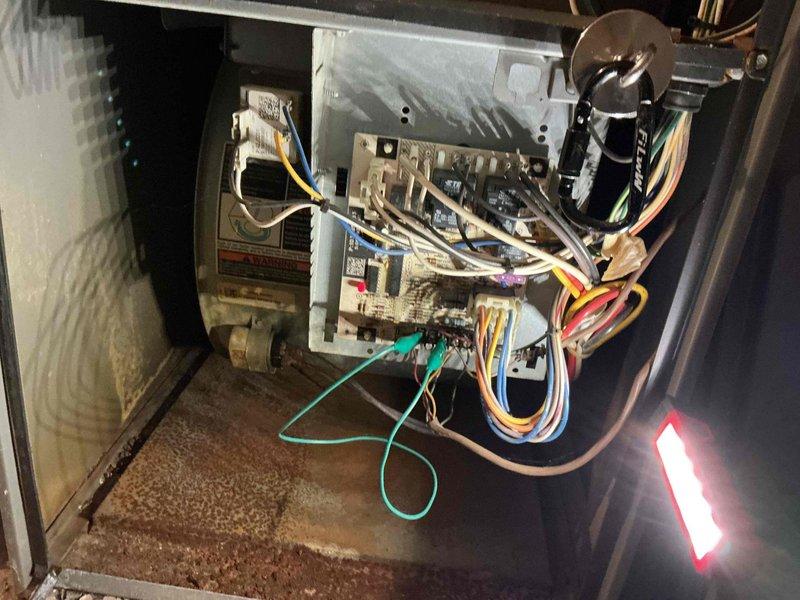 Responded to no-heat complaint for 9-year-old furnace. Diagnosed failed circuit board as evidenced by red error light on control panel. Removed and replaced non-functioning thermostat with compatible unit, restoring proper communication with furnace system. System now operating normally with proper heating function restored.
