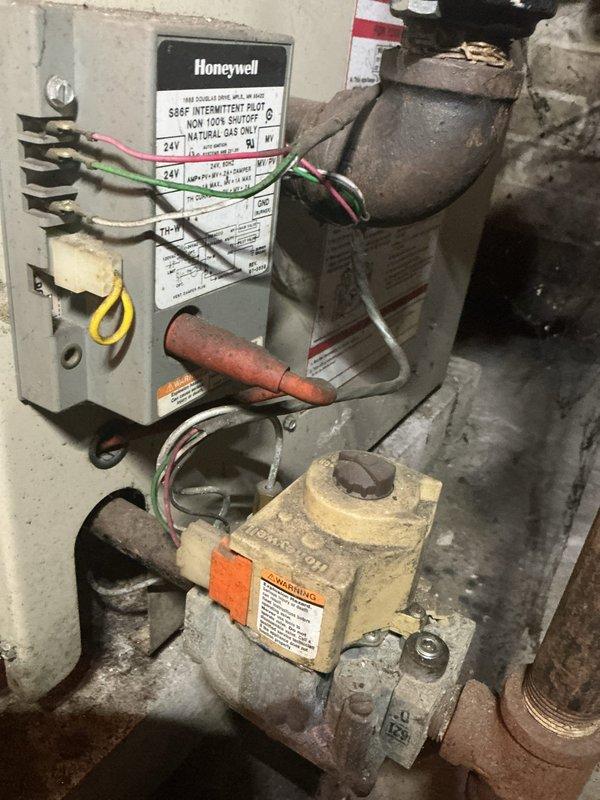 Completed second appointment to replace check valve and pressure reducing valve on boiler system. During refill procedure, identified leak in one radiator. System is now operational with Honeywell S8610F intermittent pilot control and VR8204A gas valve functioning properly. Additional visit required to address radiator leak by relocating unit and capping pipes.