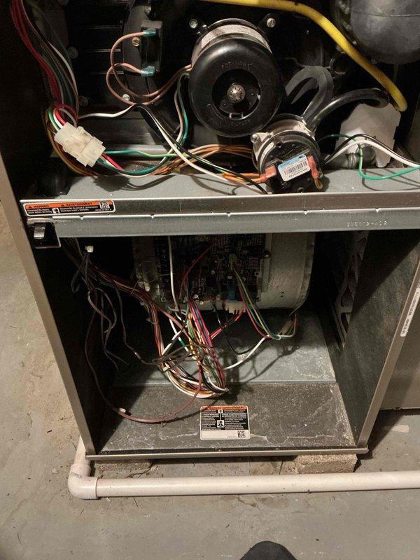 Responded to no heat call, inspected furnace with access panels removed. Performed diagnostic assessment of blower motor, electrical connections, and circuit board. Identified and resolved issue causing heating failure, restoring proper system operation.