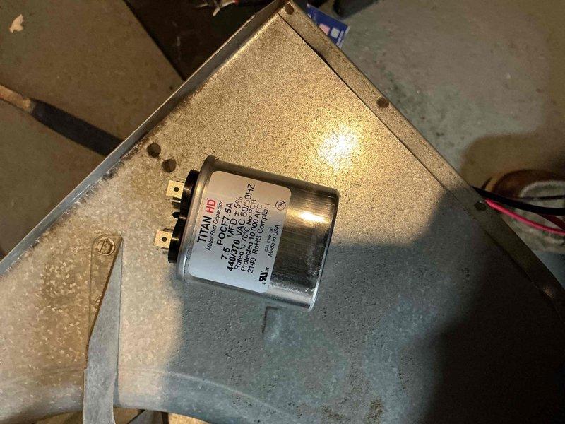 Responded to urgent service call for 30-year-old furnace that was repeatedly cycling off and failing to heat properly. Diagnosed and replaced failed capacitor (TITAN HD 440VAC 5μF) which was preventing proper blower motor operation. System is now functioning correctly, restoring heat to home with elderly residents and children where frozen pipes were a concern.
