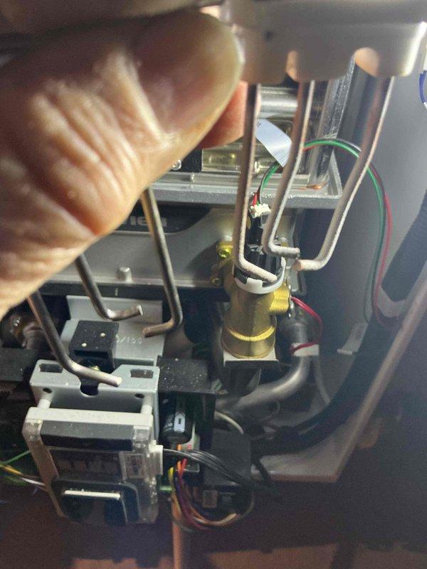 Performed courtesy check on boiler following customer-reported shutdown and reset. Inspected internal components including control valve, electrical connections, and sensor assembly. Confirmed unit is currently operating properly; no issues identified that would cause system failure during cold weather operation.