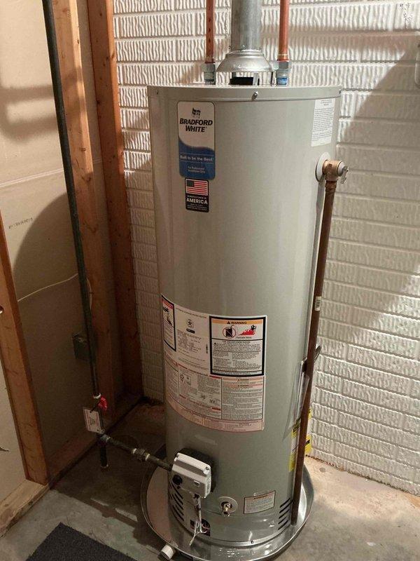 Responded to emergency service call for Bradford White water heater that had developed a significant leak. Upon inspection, determined unit required replacement. Successfully installed new Bradford White tanked water heater with proper copper line connections and expansion tank. Verified all connections were secure, restored water and gas service to home, and confirmed proper operation before completing service.
